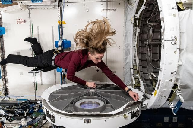 NASA image: Astronaut Nichole Ayers opens the hatch to the Kibo laboratory module's airlock