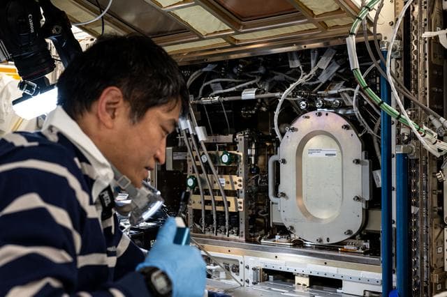 NASA image: JAXA astronaut Takuya Onishi swaps combustion research hardware inside the Kibo laboratory module