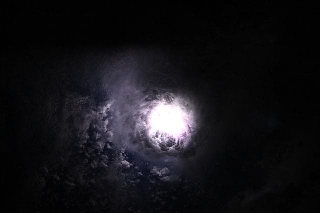 NASA image: Lightning illuminates the clouds during a storm off the coast of North Carolina