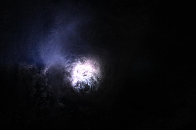 NASA image: Lightning illuminates the clouds during a storm off the coast of North Carolina