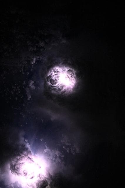 NASA image: Lightning illuminates the clouds during a storm off the coast of North Carolina