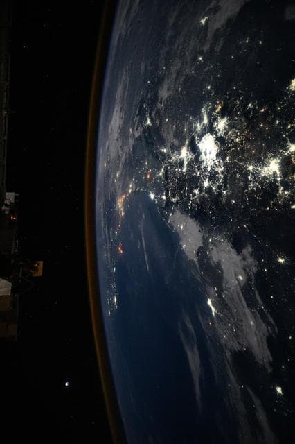 NASA image: The city lights of Mexico City and its surrounding suburbs dominate the nightscape