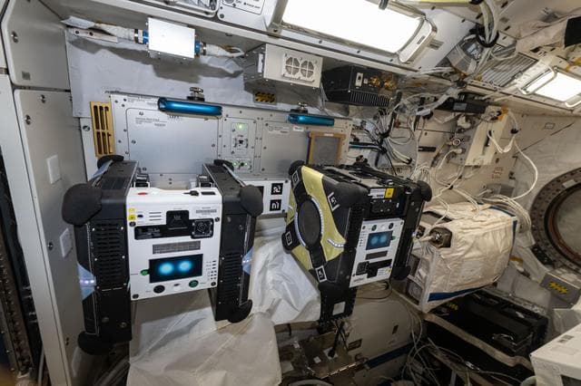 NASA image: A pair of Astrobee robotic free-flyers are pictured inside the Kibo laboratory module