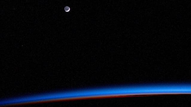 NASA image: The waning crescent Moon above Earth's horizon