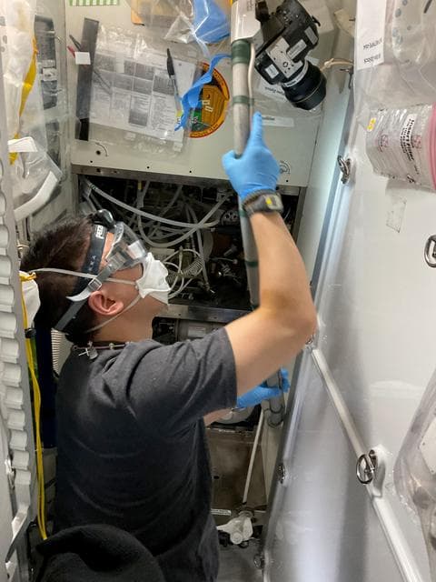 NASA image: NASA astronaut Jonny Kim replaces orbital plumbing components