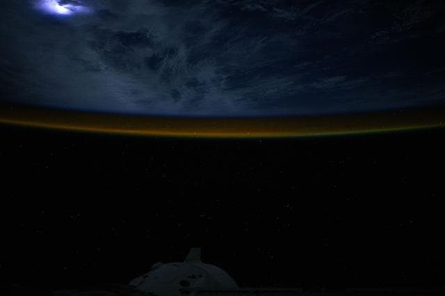 NASA image: Lightning illuminates the clouds above the Atlantic Ocean