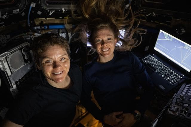 NASA image: NASA astronauts Anne McClain and Nichole Ayers pose for a portrait inside the cupola