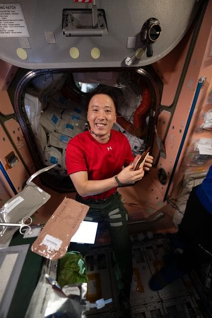 NASA image: NASA astronaut Jonny Kim shows off a barbeque brisket taco