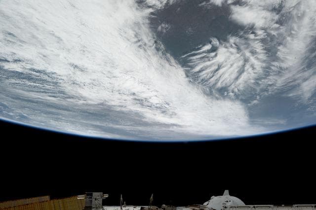 NASA image: Wichita, Kansas, surrounded by clouds covering the midwestern United States