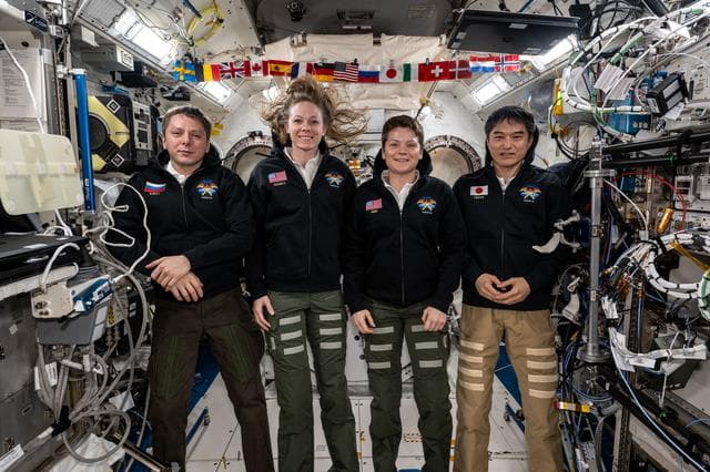 NASA image: NASA's SpaceX Crew-10 members pose for a group portrait
