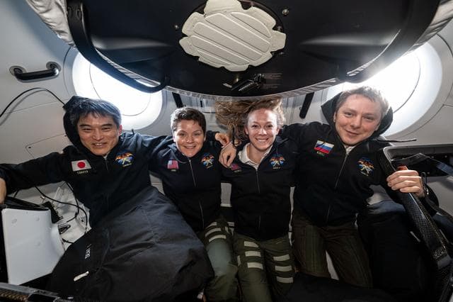 NASA's SpaceX Crew-10 members pose for a portrait inside the SpaceX Dragon