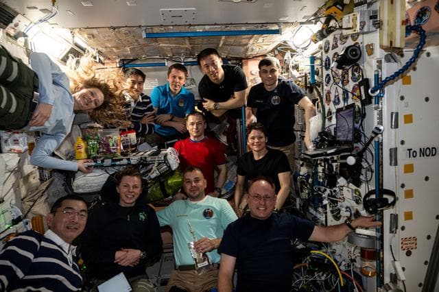 NASA image: Eleven International Space Station crew members gather for a portrait
