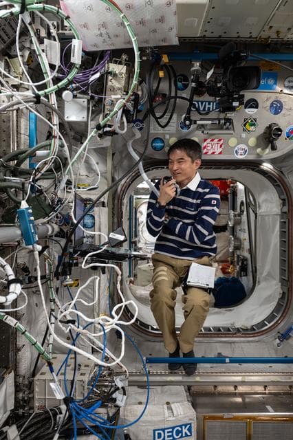 NASA image: JAXA astronaut Takuya Onishi speaks on a ham radio with Japanese students