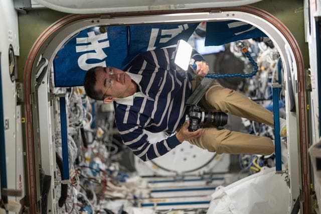 NASA image:  JAXA astronaut Kimiya Yui inspects hardware inside the Kibo laboratory module