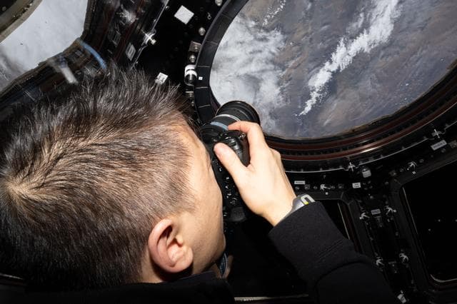 NASA image: NASA astronaut Jonny Kim points his camera out a window and photographs Earth landmarks 