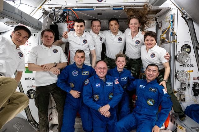NASA image: Expedition 73 poses for a portrait after welcoming four new crew members