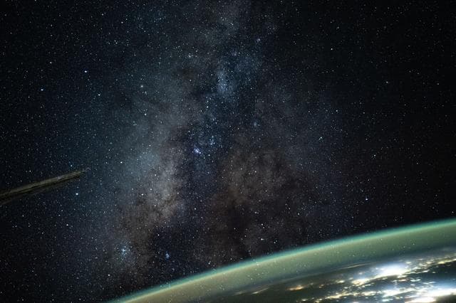 NASA image: The Milky Way appears above Earth's bright atmospheric glow