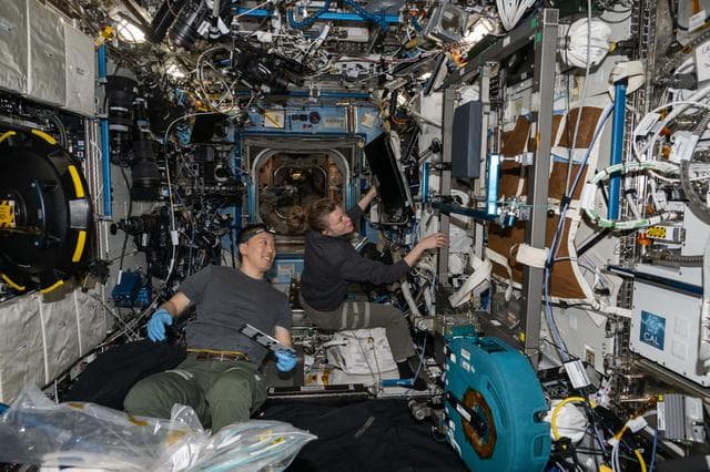 NASA image: Expedition 73 Flight Engineers work together inside the Destiny laboratory module