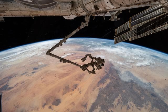 NASA image: The Canadarm2 with its fine-tuned robotic hand, Dextre