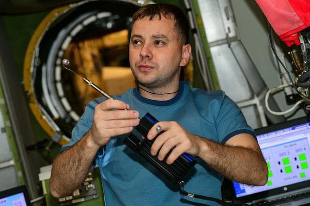 NASA image: Roscosmos cosmonaut Oleg Platonov is pictured with an air sampling device