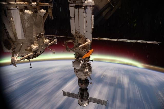 NASA image: The aurora australis streams above Earth's horizon