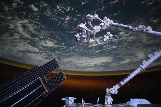 NASA image: The Canadarm2 robotic arm with Dextre above the Indian Ocean