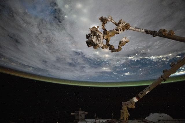 NASA image: The Canadarm2 robotic arm with Dextre above the coast of Cambodia