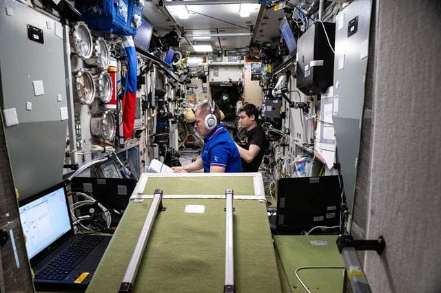 NASA image: Cosmonauts Sergey Ryzhikov and Alexey Zubritsky monitor the arrival of the Progress 93 cargo craft