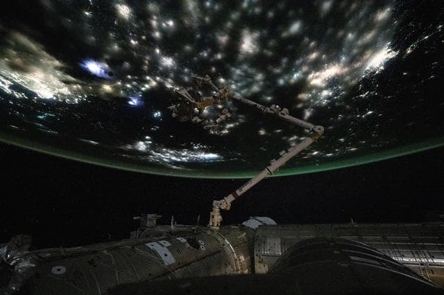 NASA image: City lights beneath the clouds highlight the North China Plain near the Yellow Sea