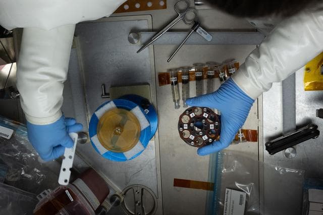 NASA image: The gloved hands of NASA astronaut inside the Microgravity Science Glovebox
