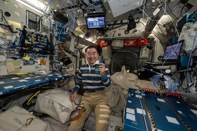 NASA image: JAXA astronautKimiya Yui smiles for a portrait during weekend housecleaning activities