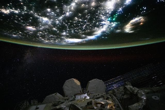 NASA image: Asian city lights and green fishing boat lights 