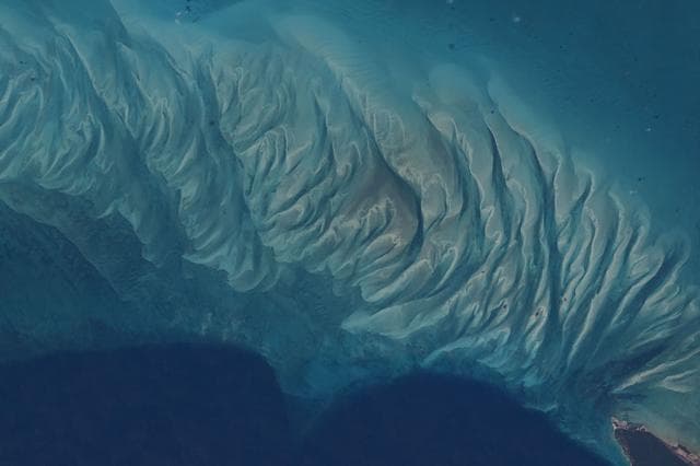 NASA image: The clear blue waters off the coast of the Bahamian island of Eleuthera