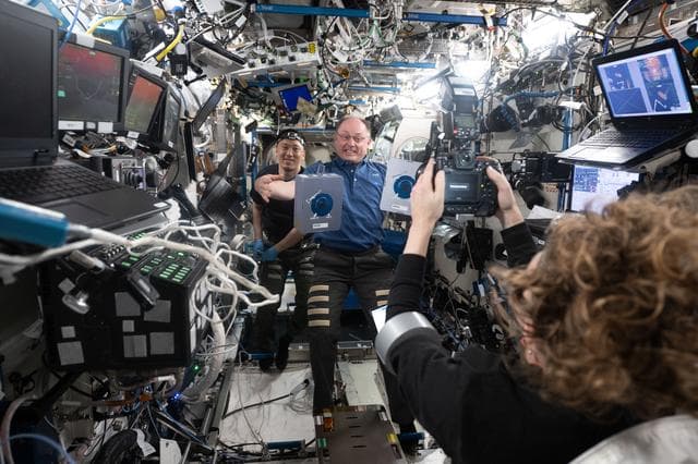 NASA image: NASA astronaut Zena Cardman photographs NASA astronauts Mike Fincke and Jonny Kim