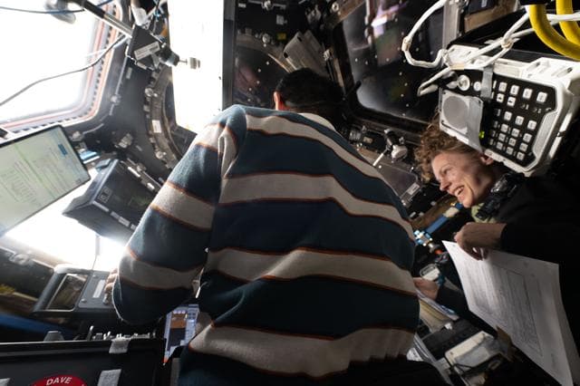 NASA image: Astronauts Kimiya Yui and Zena Cardman train inside the cupola to use the Canadarm2 robotic arm