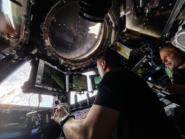 NASA image: NASA astronauts Jonny Kim and Zena Cardman practice Canadarm2 robotic maneuvers at the robotics workstation