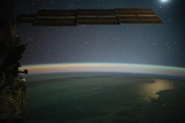NASA image: Serene image of the Moon glinting off the Southern Pacific Ocean