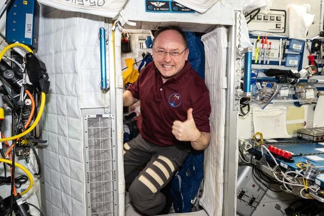 NASA image: NASA astronaut Mike Fincke poses for a portrait inside his crew quarters
