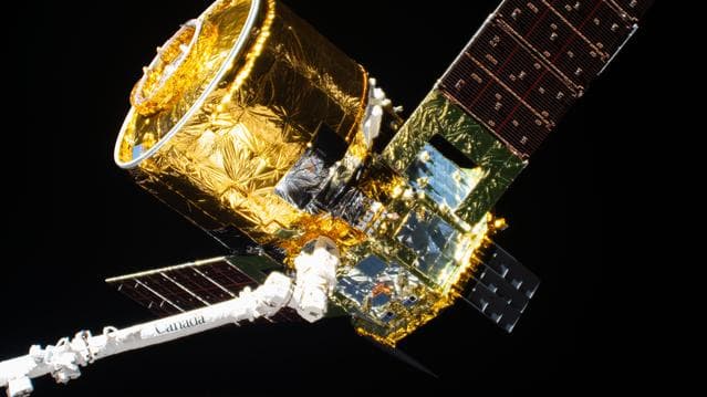 NASA image: The new HTV-X1 in the grips of the Canadarm2