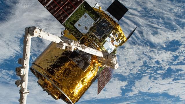 NASA image: The HTV-X1 cargo spacecraft is pictured in the grip of the Canadarm2 robotic arm
