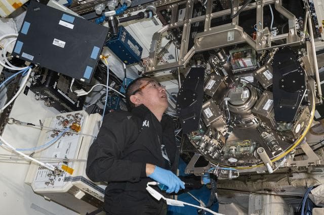 NASA image: JAXA astronaut Kimiya Yui inspects and cleans hardware