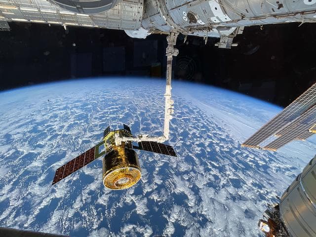 NASA image: The new HTV-X1 in the grips of the Canadarm2