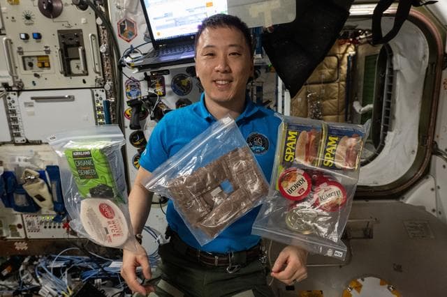 NASA image: NASA astronaut Jonny Kim shows off a variety of food items from South Korea and the U.S.