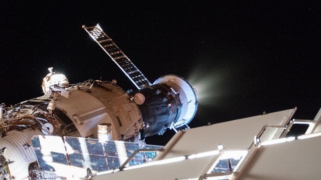 NASA image: The Progress 93 cargo craft fires its engines to raise the International Space Station's orbit