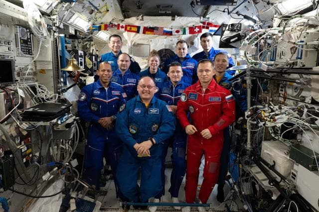NASA image: Ten International Space Station crew members representing Expedition 73 and 74 pose for a portrait