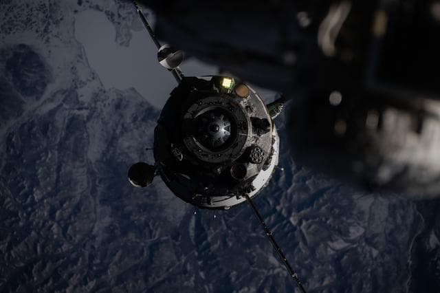 NASA image: The Soyuz MS-27 spacecraft backs ways from the International Space Station