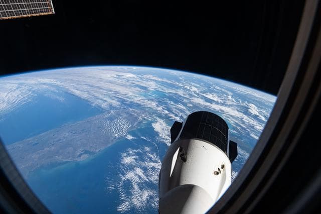 NASA image: The SpaceX Dragon cargo spacecraft with southern Florida visible below