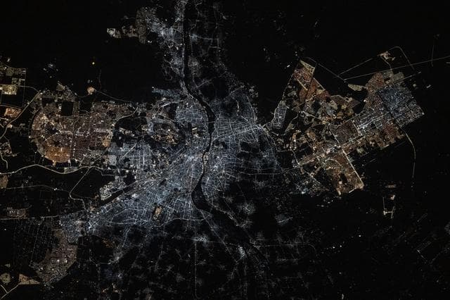 NASA image: The Cairo metropolitan area is split by the Nile River at the base of the Nile Delta