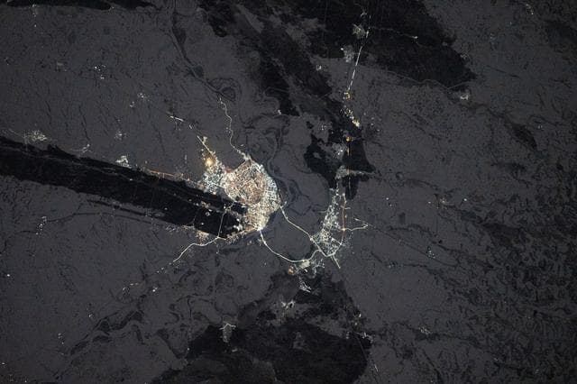 NASA image: The city lights of Barnaul in Siberia, Russia, contrast with the extreme winter landscape