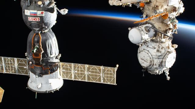 NASA image: The International Space Station orbits into a sunset above China